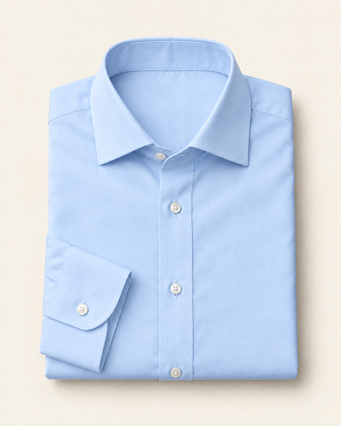 Folded pale blue poplin dress shirt.