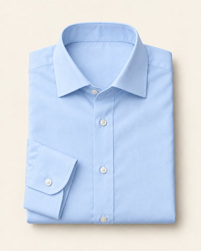 Illustrative pale blue poplin dress shirt, folded to show its collar and cuff.