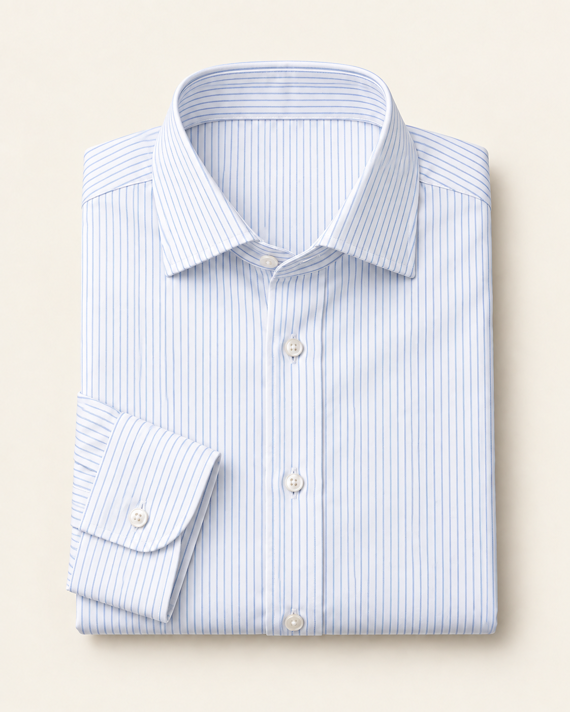 Folded white dress shirt with fine blue stripes.