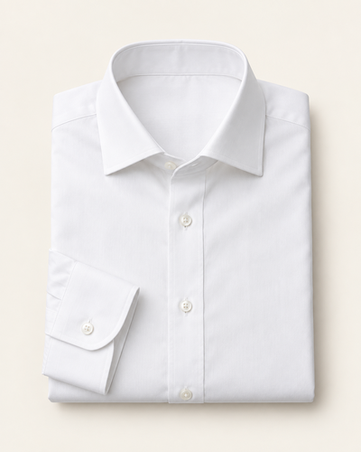 Illustrative white poplin dress shirt, folded to show its collar and cuff.